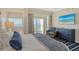 Beautifully decorated bedroom with ocean views, balcony access, and stylish blue accents at 230 Sands Point Rd # 3501, Longboat Key, FL 34228