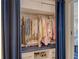 Organized walk-in closet with hanging space, shelving, and built-in storage at 230 Sands Point Rd # 3501, Longboat Key, FL 34228