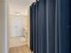 Hallway view to the bathroom and closet area, featuring modern finishes at 230 Sands Point Rd # 3501, Longboat Key, FL 34228