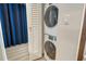 Efficient laundry area with stackable washer and dryer units, maximizing space in the home at 230 Sands Point Rd # 3501, Longboat Key, FL 34228