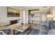 Cozy living room area featuring modern decor, a flat screen TV, and breakfast bar at 230 Sands Point Rd # 3501, Longboat Key, FL 34228