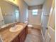 Bathroom with a combination tub and shower, plus vanity with hard surface countertop at 2309 30Th W Ave, Bradenton, FL 34205