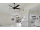 Open kitchen with an island and modern appliances flows into the living room, creating an inviting space at 23116 Amethyst Ave, Port Charlotte, FL 33952