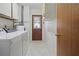 Practical laundry room with washer, dryer, and ample storage at 23116 Amethyst Ave, Port Charlotte, FL 33952