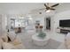 Open-concept living space with modern decor, a kitchen, and plenty of natural light at 23116 Amethyst Ave, Port Charlotte, FL 33952