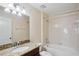 Clean bathroom with granite countertop, tub, and tile shower at 2332 Dovesong Trace Dr, Ruskin, FL 33570