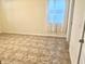 Cozy bedroom featuring tile flooring and a window with sheer curtains at 2332 Dovesong Trace Dr, Ruskin, FL 33570