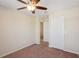 Bedroom featuring a ceiling fan, closet, neutral walls, carpeted floor, and white doors and trim at 2332 Dovesong Trace Dr, Ruskin, FL 33570