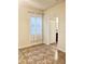 Bright bedroom with tile floors and a window and access to another room at 2332 Dovesong Trace Dr, Ruskin, FL 33570