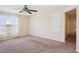 Bedroom features neutral walls, plush carpet, window with coverings and hall access at 2332 Dovesong Trace Dr, Ruskin, FL 33570