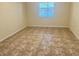 Bright bedroom with tile flooring and natural light from the window at 2332 Dovesong Trace Dr, Ruskin, FL 33570