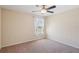 Bedroom with a ceiling fan, neutral walls, carpeted floor, and a window with sheer curtains at 2332 Dovesong Trace Dr, Ruskin, FL 33570
