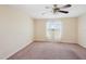 Bedroom featuring neutral walls, plush carpet, and a bright window with sheer coverings at 2332 Dovesong Trace Dr, Ruskin, FL 33570