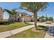 Charming two-story home with well-manicured lawn, large driveway, and mature shade trees at 2332 Dovesong Trace Dr, Ruskin, FL 33570