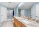 Bathroom features a double vanity with marble countertops, and walk-in shower at 2396 Malibu Ln, North Port, FL 34286