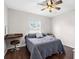 Bedroom with dark wood floors and modern lighting at 2396 Malibu Ln, North Port, FL 34286