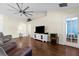 Cozy living room with hardwood floors, vaulted ceiling, and natural light at 2396 Malibu Ln, North Port, FL 34286