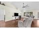 Bright living room featuring a high ceiling, hardwood floors, and large windows at 2396 Malibu Ln, North Port, FL 34286