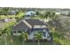 Expansive aerial view of the property showcasing the pool, landscaping, and surrounding neighborhood at 24342 Saragossa Ln, Punta Gorda, FL 33955