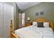 Bedroom featuring closet, bed, bedside table with lamp, and turtle wall decor at 24342 Saragossa Ln, Punta Gorda, FL 33955