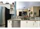 Stylish kitchen featuring granite countertops, stainless steel appliances and view to the dining area at 24342 Saragossa Ln, Punta Gorda, FL 33955