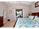 Comfortable main bedroom with view and access to screened in porch at 24342 Saragossa Ln, Punta Gorda, FL 33955
