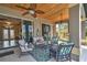 Relaxing covered patio with ceiling fans and comfortable seating, perfect for enjoying the outdoors in style at 24342 Saragossa Ln, Punta Gorda, FL 33955