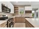 Modern kitchen with stainless steel appliances, stylish cabinetry, and ample counter space, perfect for cooking and entertaining at 299 Australian Dr, Rotonda West, FL 33947