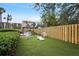 Community backyard area featuring a gazebo, chairs, and a cornhole set at 3006 Caring Way # 210, Port Charlotte, FL 33952