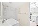 Bright bathroom featuring a shower with updated fixtures and a vanity sink with tile flooring at 3006 Caring Way # 210, Port Charlotte, FL 33952