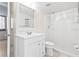 Bathroom featuring a single sink vanity, large mirror, and shower with clear curtain at 3006 Caring Way # 210, Port Charlotte, FL 33952