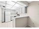 Efficient white kitchen with ample counter space and a functional breakfast bar at 3006 Caring Way # 210, Port Charlotte, FL 33952