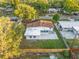 Aerial view of house featuring new fence and large backyard, set in neighborhood with mature trees at 3169 Bellevue St, Sarasota, FL 34237