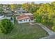 Aerial view of home with large yard, mature trees, and a new privacy fence at 3169 Bellevue St, Sarasota, FL 34237