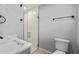 A well-lit bathroom with a modern glass enclosed shower, sleek fixtures, and a neutral color palette, perfect for relaxation at 3169 Bellevue St, Sarasota, FL 34237