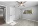 This bedroom offers natural light, with a ceiling fan and wood look floors, enhancing the inviting feel of the room at 3169 Bellevue St, Sarasota, FL 34237