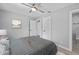 A bright bedroom featuring neutral walls, two windows, and access to an attached bathroom, providing comfort and convenience at 3169 Bellevue St, Sarasota, FL 34237