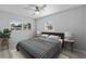 This bedroom features a ceiling fan, neutral walls, and two windows, providing a calming and bright atmosphere at 3169 Bellevue St, Sarasota, FL 34237