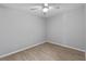 A bright bedroom with tile floors and a ceiling fan, providing a blank canvas to create your perfect retreat at 3169 Bellevue St, Sarasota, FL 34237