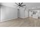 An open-concept living space with tile floors, neutral paint, and a seamless transition to the kitchen at 3169 Bellevue St, Sarasota, FL 34237