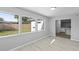 Bright and airy living room with large windows offering ample natural light and views of the backyard at 3169 Bellevue St, Sarasota, FL 34237