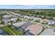 A neighborhood with houses and palm trees beside a highway in a sunny environment at 3508 Anchor Bay Trl, Lakewood Ranch, FL 34211