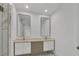 Bathroom with double sinks and modern mirrors at 3694 Crittendon St, North Port, FL 34286