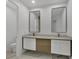 Bathroom with double sinks and modern mirrors at 3694 Crittendon St, North Port, FL 34286