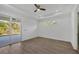 Modern bedroom features recessed lighting, wood flooring, and sliding glass doors at 3694 Crittendon St, North Port, FL 34286