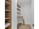 Walk-in closet featuring built in shelving and a desk at 3694 Crittendon St, North Port, FL 34286