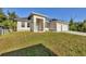 Beautiful single-story home featuring a two-car garage and well-manicured lawn at 3694 Crittendon St, North Port, FL 34286