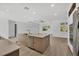 Open kitchen area with large island and seating at 3694 Crittendon St, North Port, FL 34286