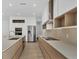 Modern kitchen features an island, stainless steel appliances, and light countertops at 3694 Crittendon St, North Port, FL 34286