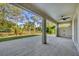 Open outdoor patio space featuring tiled flooring and a ceiling fan at 3694 Crittendon St, North Port, FL 34286